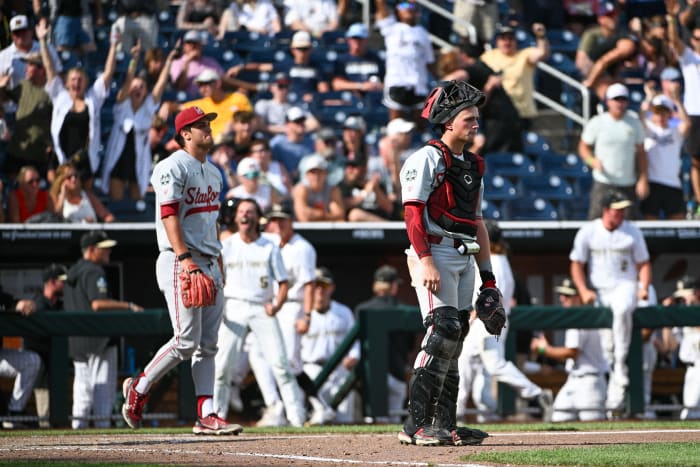 Jun 17, 2023; Omaha, NE, USA; Stanford Cardinal catcher Malcolm Moore (10) and pitcher Ryan Bruno (34) return to the field after the Wake Forest Demon Deacons score the go ahead run in the eighth inning at Charles Schwab Field Omaha. Mandatory Credit: Steven Branscombe-USA TODAY Sports